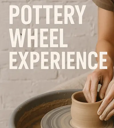 Hands shaping clay on a pottery wheel in a beginner-friendly pottery class experience